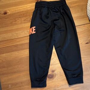 Nike Kids Black Sweatpants with Orange Logo
